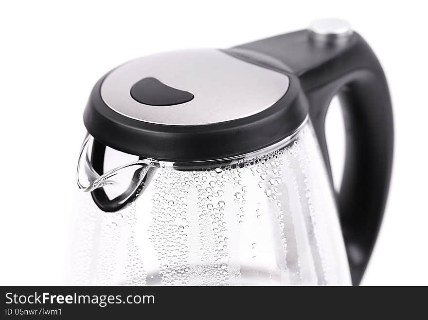 Water boiling in the glass electric kettleon a white background. Water boiling in the glass electric kettleon a white background.