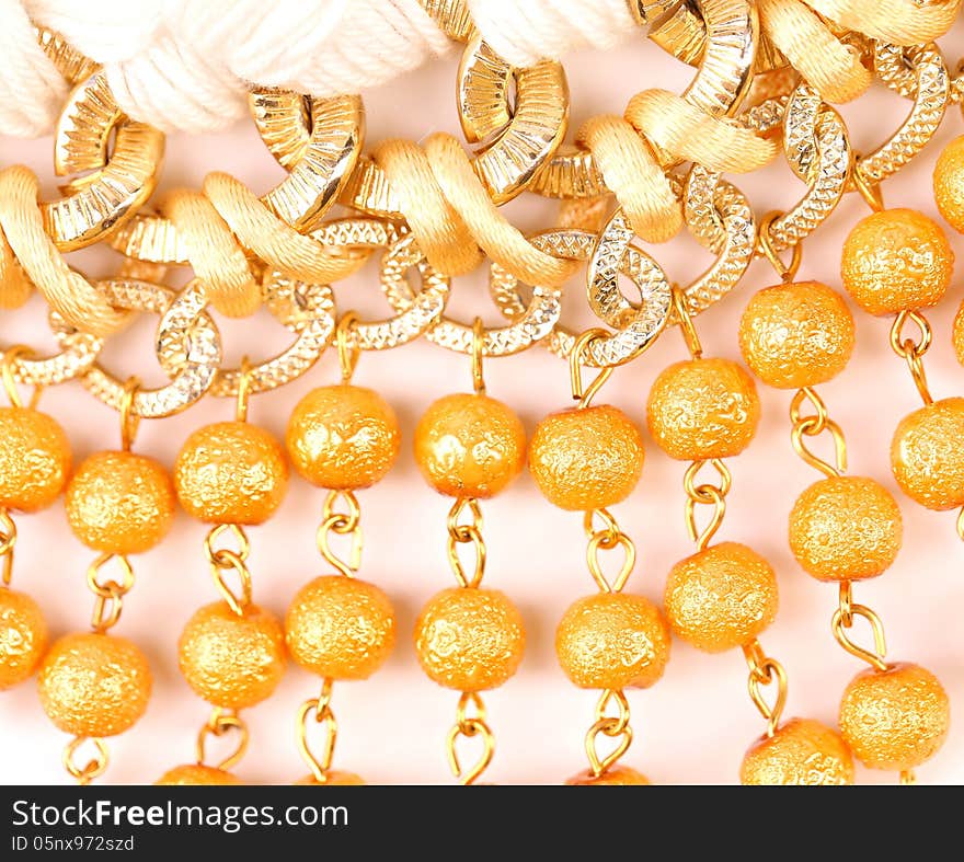 Golden pearls with macrame