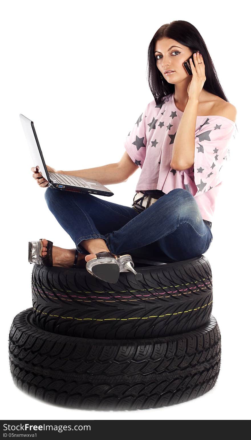 Young girl holding a car wheel, isolated on white. Young girl holding a car wheel, isolated on white.