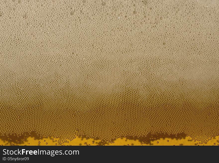 Champagne bubbles of carbon dioxide yellow background