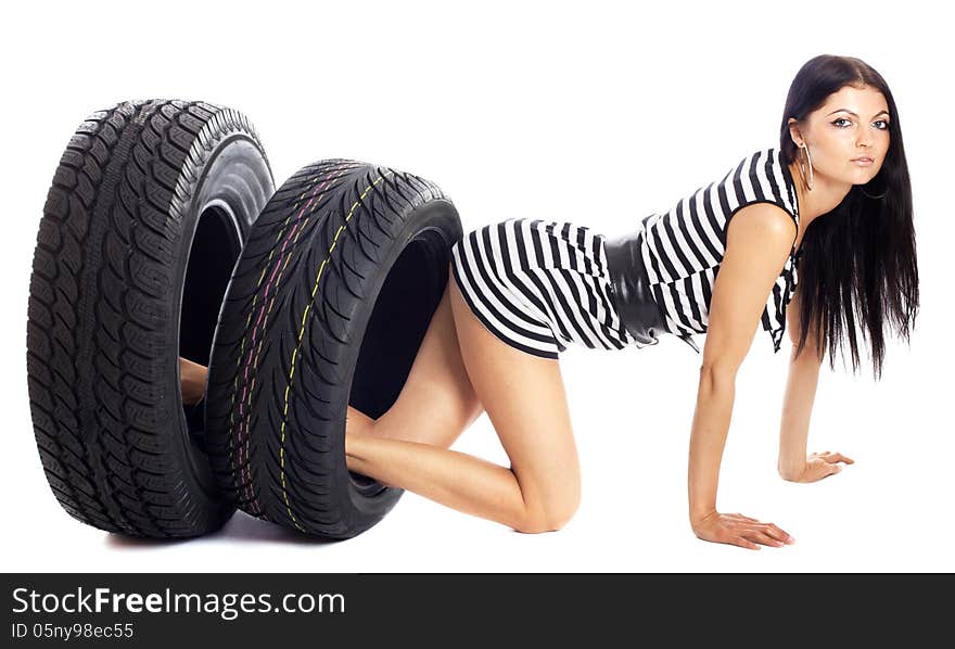 Young girl holds in her hand the car wheels, isolated on white. Young girl holds in her hand the car wheels, isolated on white.