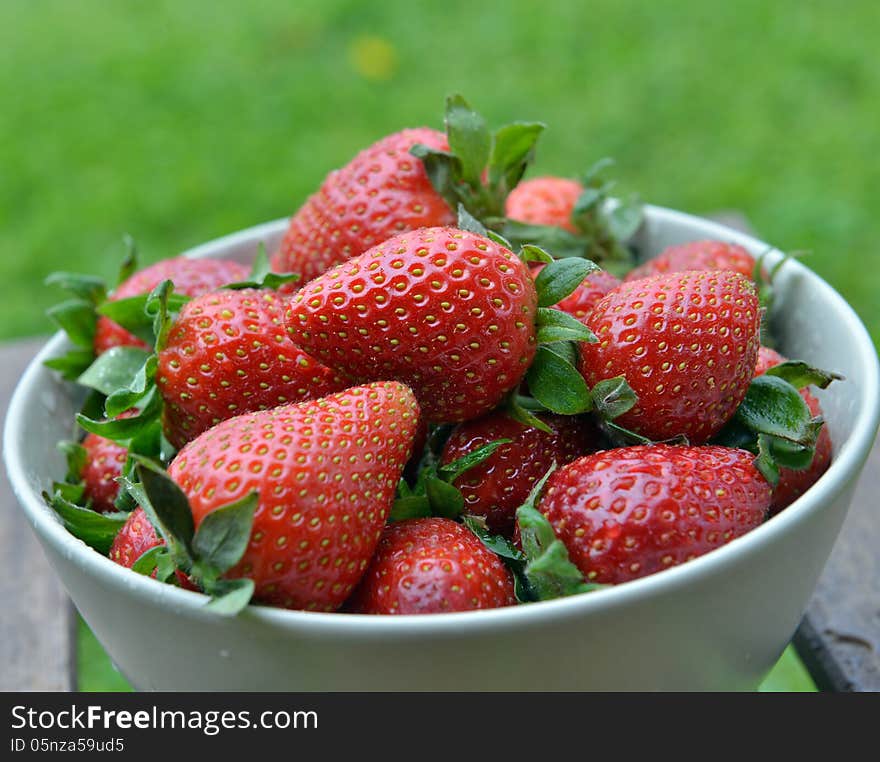 Strawberries in a bowl on a table