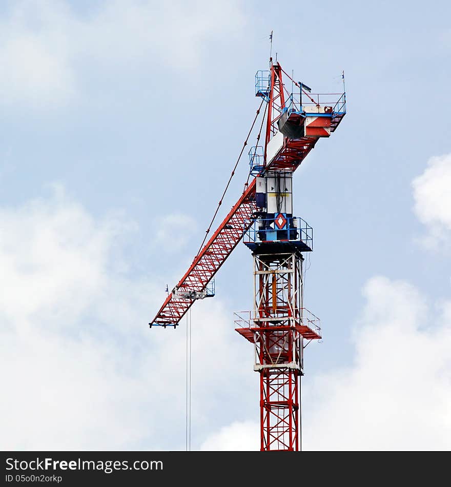 Working crane against beautiful sky