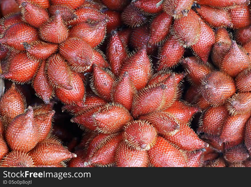 Pile of zalacca on market tray