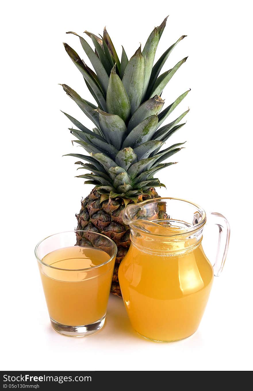 Full glass and jug of pineapple juice on a white