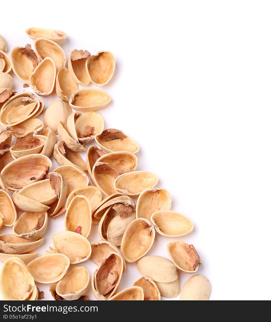 Hull pistachios are located left on a white background