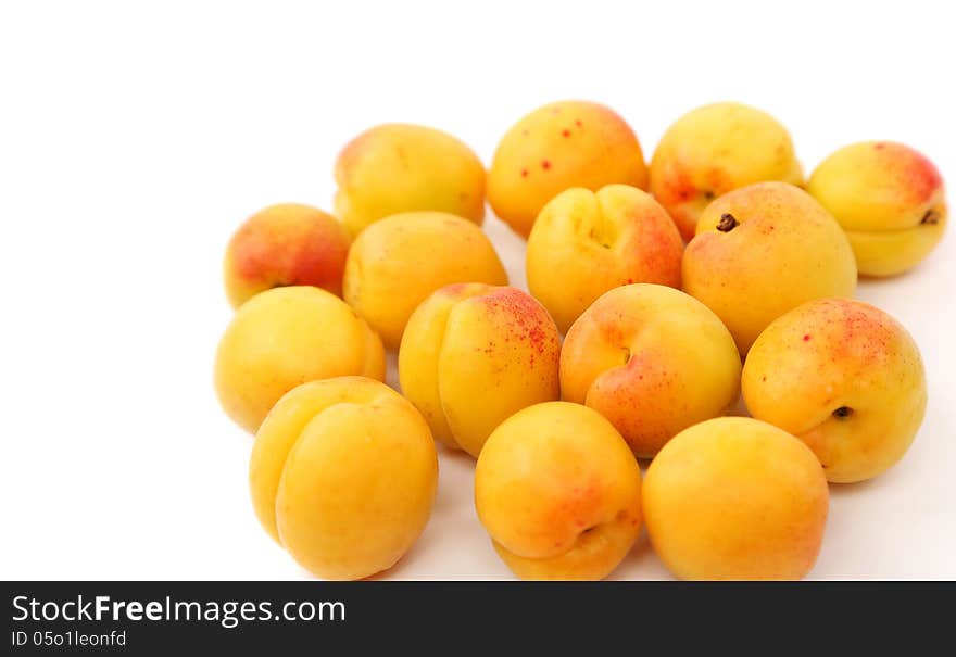 A lot of fresh apricots isolated on a white background