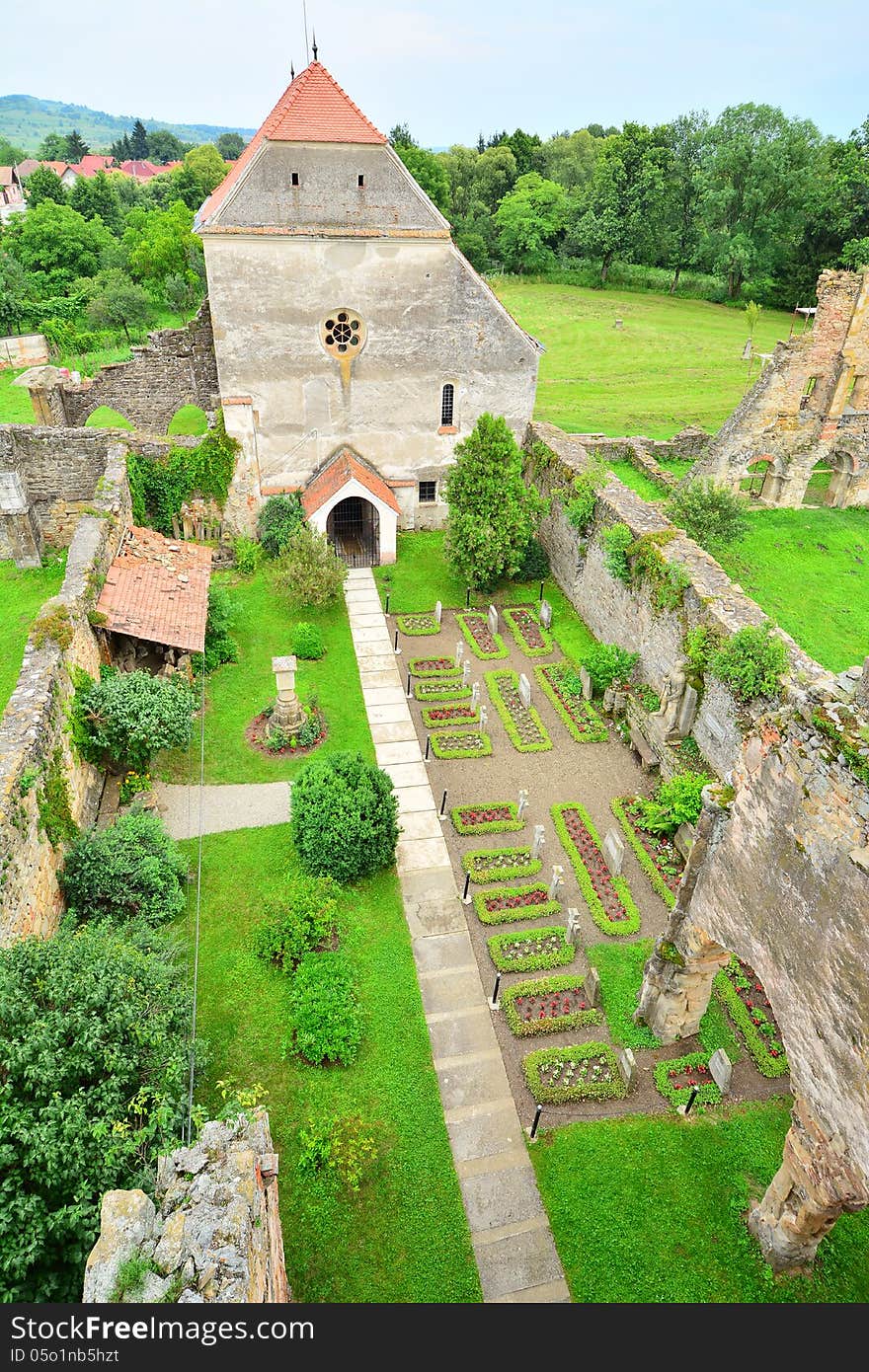 A tower view of a Gothic monastery remains.