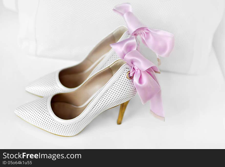 White elegant woman shoes.