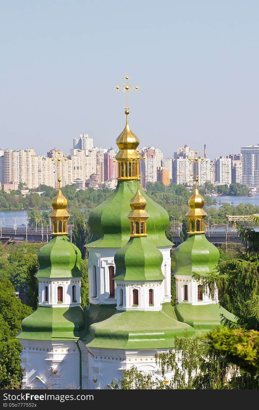 View of green domes and golden crosses of Vydubychi monastery in Kiev. View of green domes and golden crosses of Vydubychi monastery in Kiev