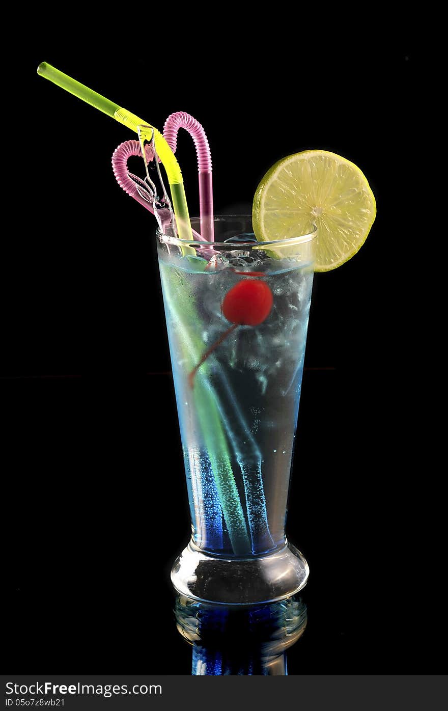 Blue cocktail with ice and lime