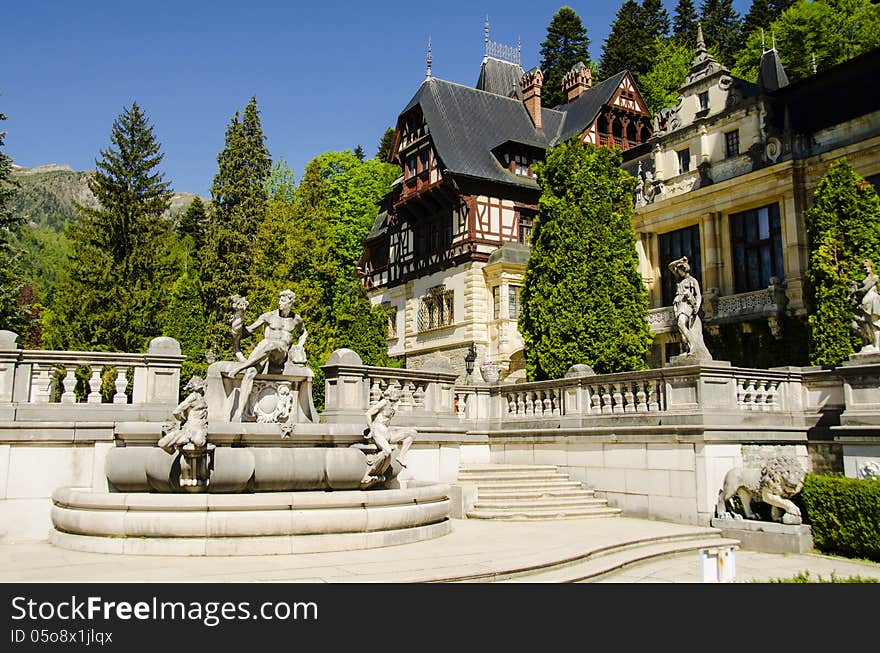 Peles castle in sinaia with the carpathian mountains in the background, romania