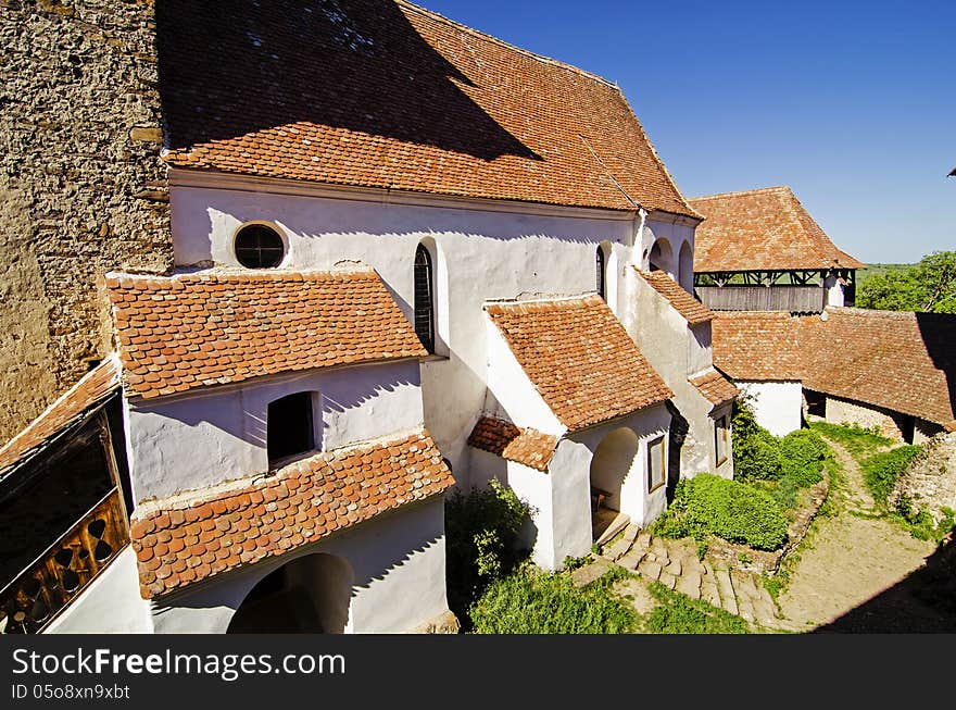 The origins of the fortified church date from 1100 when the Székelys built a small church with a single hall and semicircular apse. Around 1185 the church was taken over by Saxon colonists, and the Székelys were forced to settle further north. In the 14th century the eastern part of the church was rebuilt and in 1525, the first fortifications with towers were added. In the 18th century the church was surrounded by a second defense wall. The origins of the fortified church date from 1100 when the Székelys built a small church with a single hall and semicircular apse. Around 1185 the church was taken over by Saxon colonists, and the Székelys were forced to settle further north. In the 14th century the eastern part of the church was rebuilt and in 1525, the first fortifications with towers were added. In the 18th century the church was surrounded by a second defense wall.