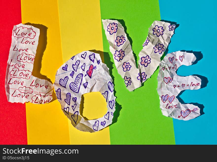 Colorful background of hand-made letters stacked in a word love