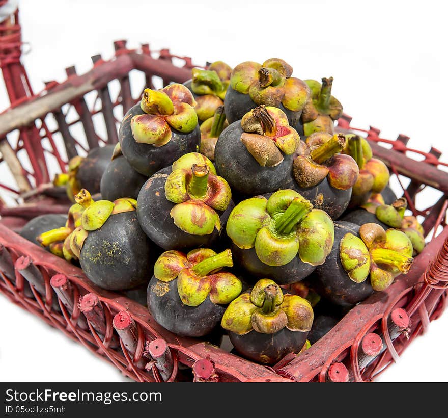 Mangosteen fruit in basket isolated and white background.