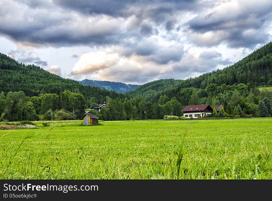 A vast Meadow leading to mountains.