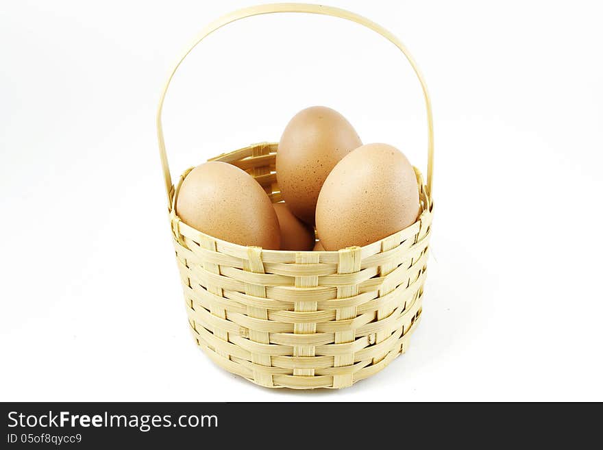 Eggs in bamboo basket with white background