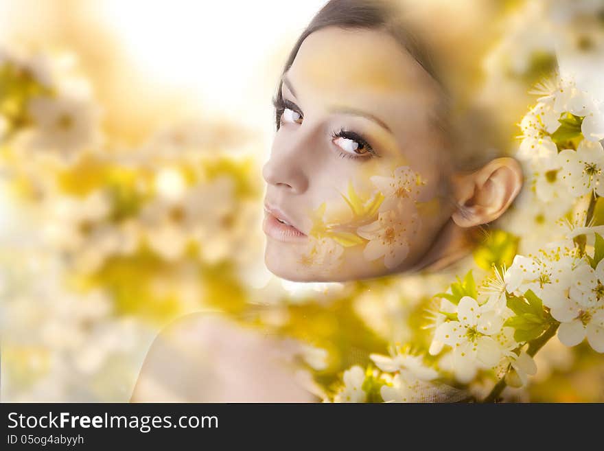 Pretty young woman portrait with white flowers