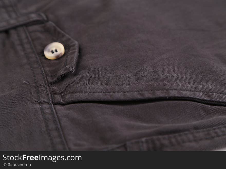 Side pocket classic black jeans. Closeup.