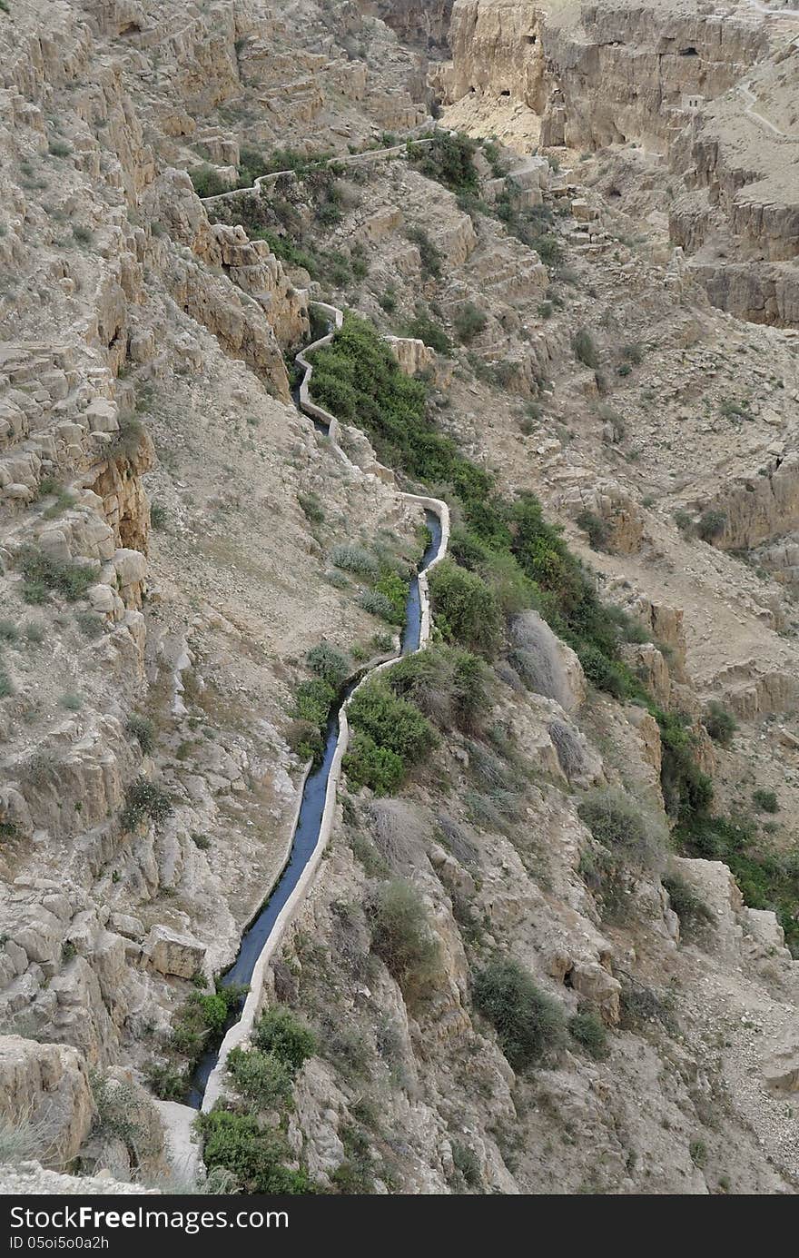 Ancient water conduit in wadi Qelt gorge, Judea desert in Israel. Ancient water conduit in wadi Qelt gorge, Judea desert in Israel.