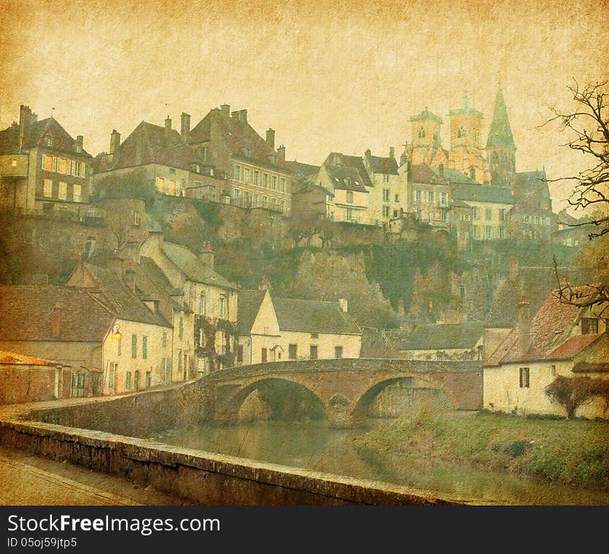 Semur-en-Auxois. Burgundy, France. Photo in retro style. Paper texture.