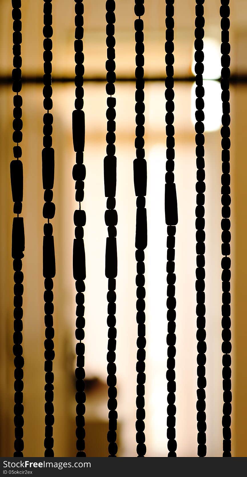 Wood beaded curtain silhouette. Wood beaded curtain silhouette