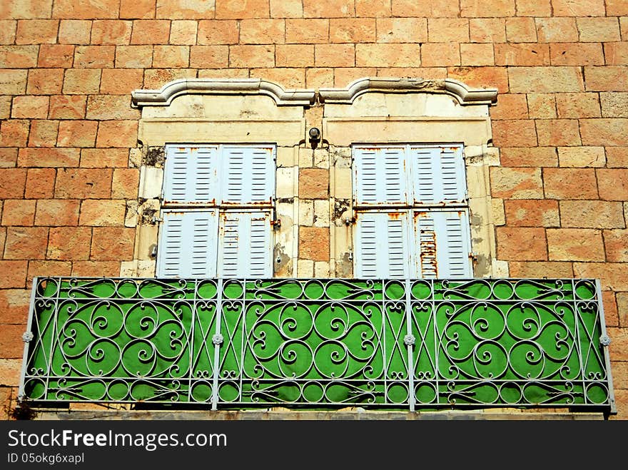 Old balcony on the facade of old building made of Jerusalem Stone in Jerusalem, Israel.