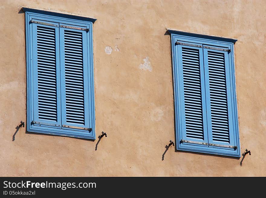 Two old blue Mediterranean blue windows in Tel Aviv, Israel. Two old blue Mediterranean blue windows in Tel Aviv, Israel.