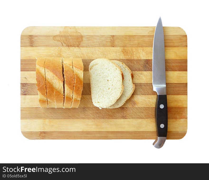 Sliced bread and kitchen knife on cutting board