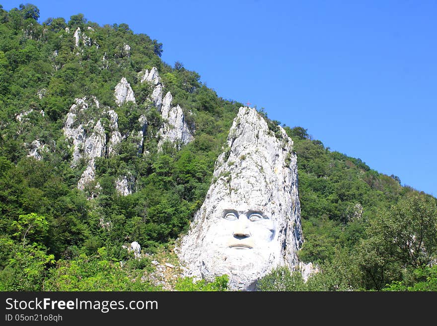 Decebal face carved in the mountains on the Danube Clisura in the Cazane gorge,Romania. Decebal face carved in the mountains on the Danube Clisura in the Cazane gorge,Romania.