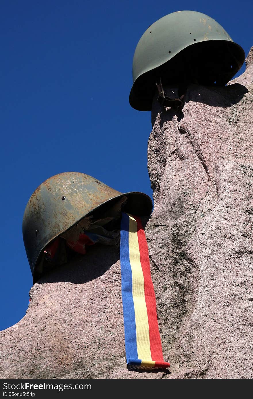 Monument of casualities of World War II with german and soviet helmet