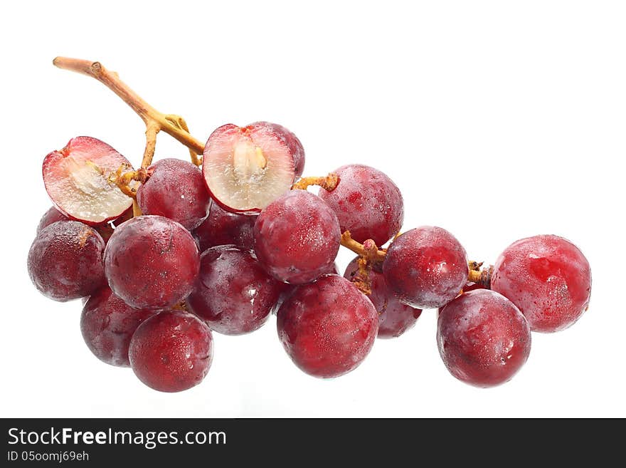 Bunch of red grapes isolated on white