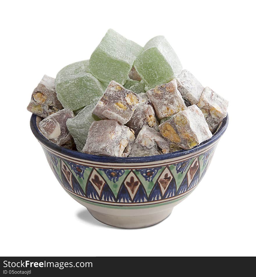 Bowl with turkish delight, isolated over white