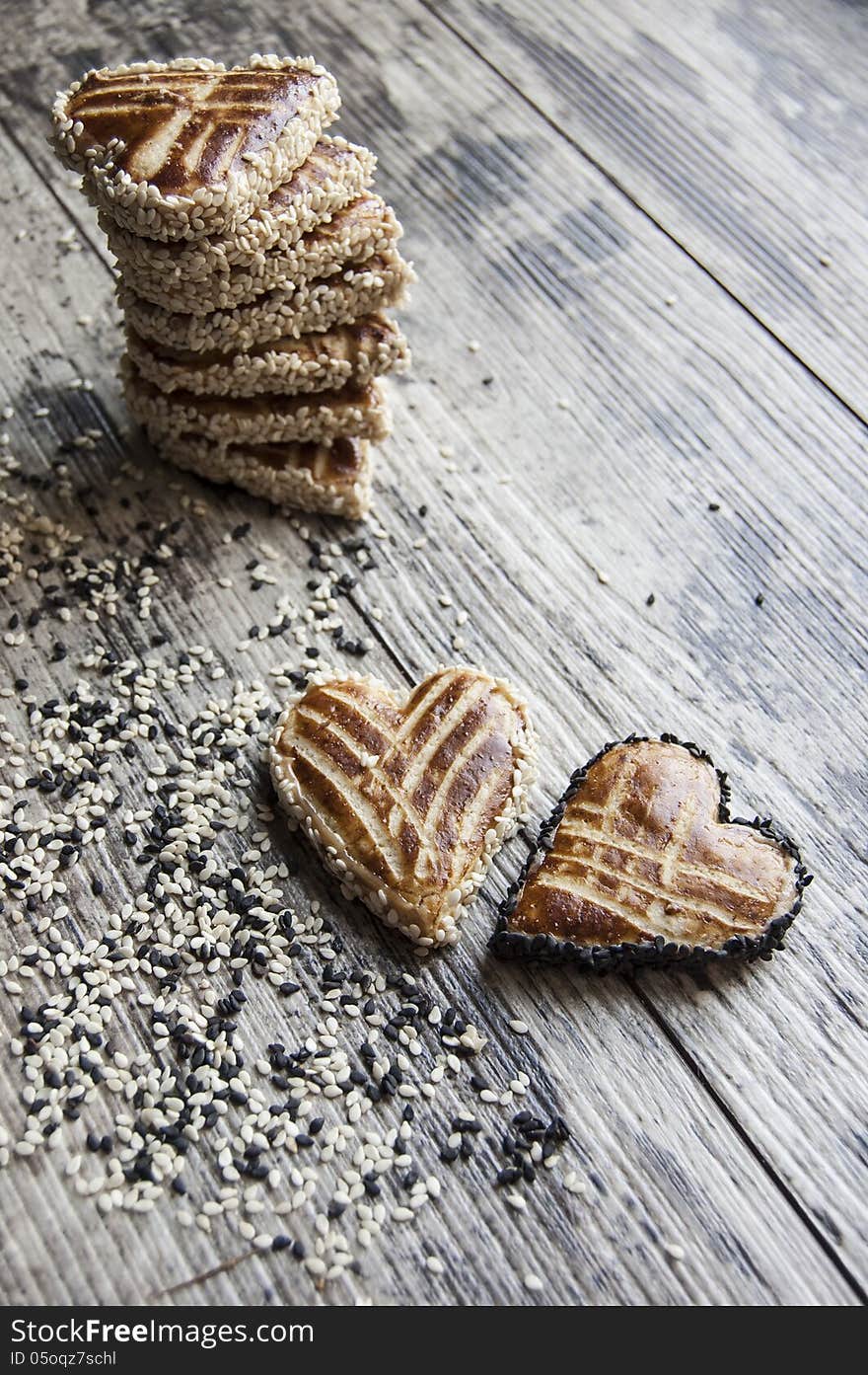 Cookies in the shape of heart on the table. Retro style. From the series Valentine's Day Cookies. Cookies in the shape of heart on the table. Retro style. From the series Valentine's Day Cookies