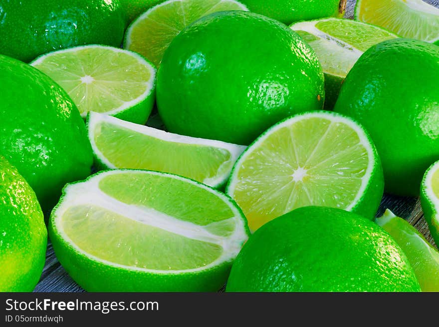 Limes on a wooden table. Limes on a wooden table