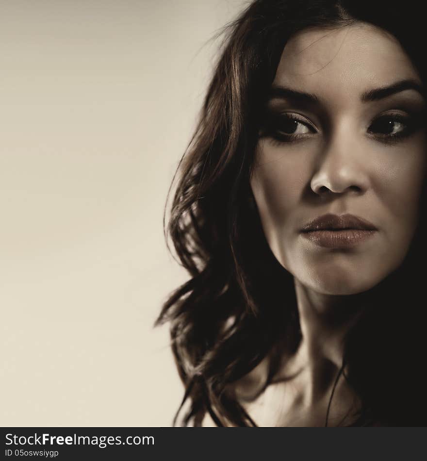 Mixed race woman looking far away. Dramatic female portrait