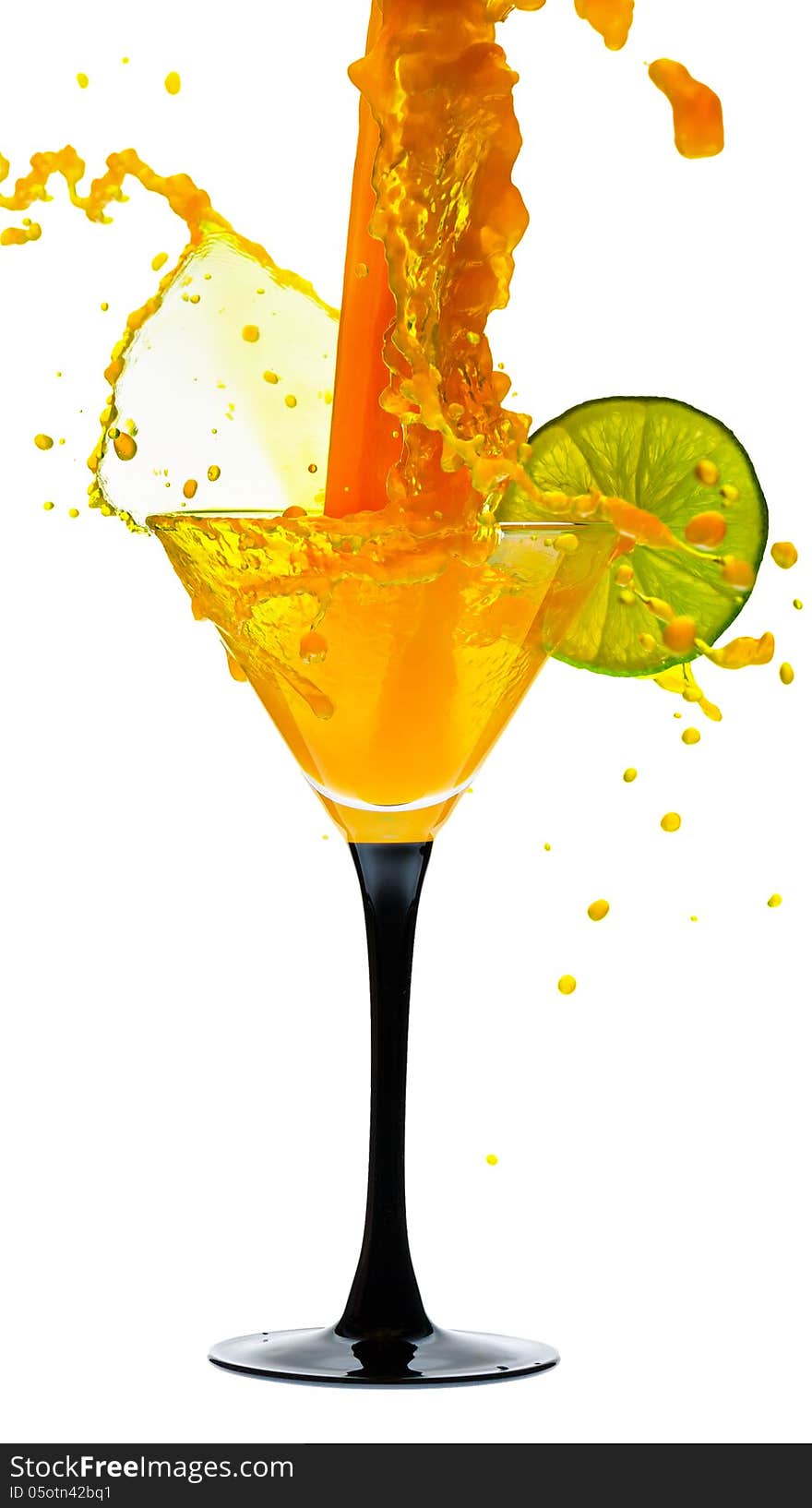 Martini glass with lime and a splash of on white background