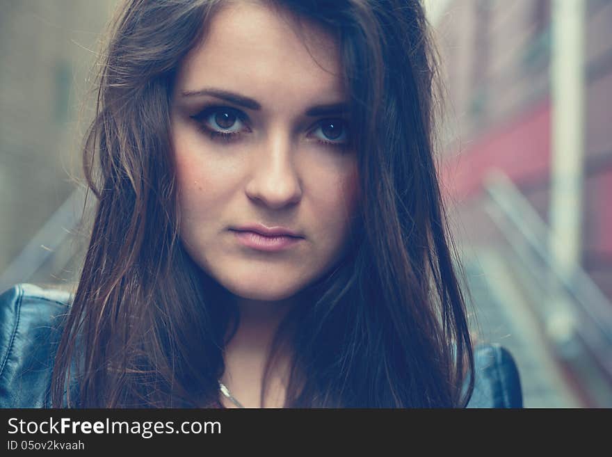 Portrait of the serious beautiful girl outdoor