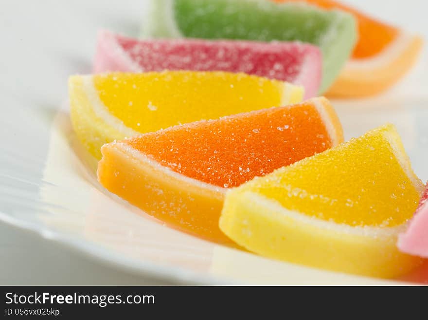 Color fruit jelly candies  on white plate