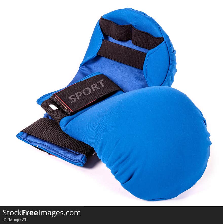 Blue karate gloves on white background with black slip. Blue karate gloves on white background with black slip