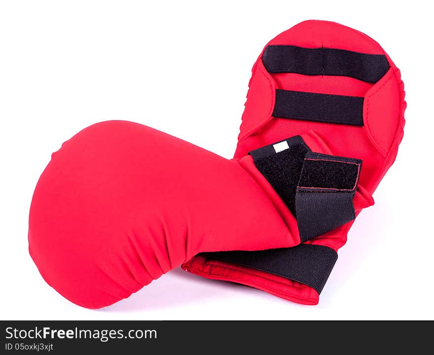 Red karate gloves on white background with black slip