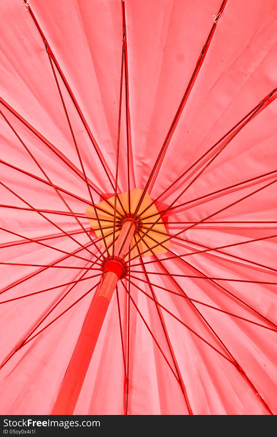 Red umbrella under the sun