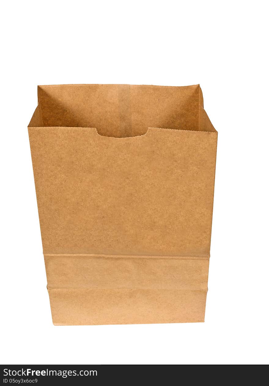 Vertical shot of a brown paper bag opened and isolated on a white background. Vertical shot of a brown paper bag opened and isolated on a white background.