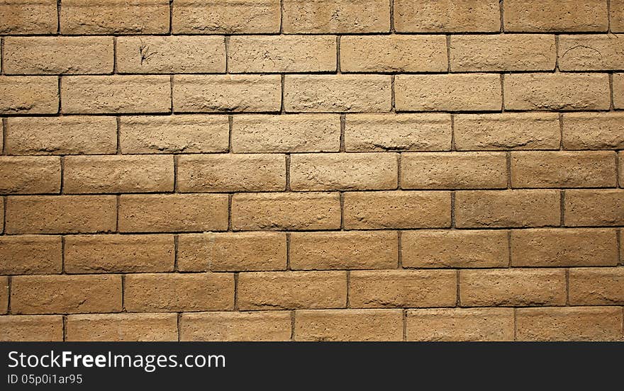 A brown cinder block wall