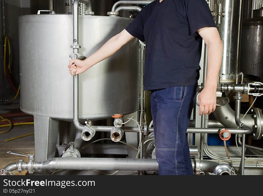 Craftsman at work with an industrial equipment for maintenance