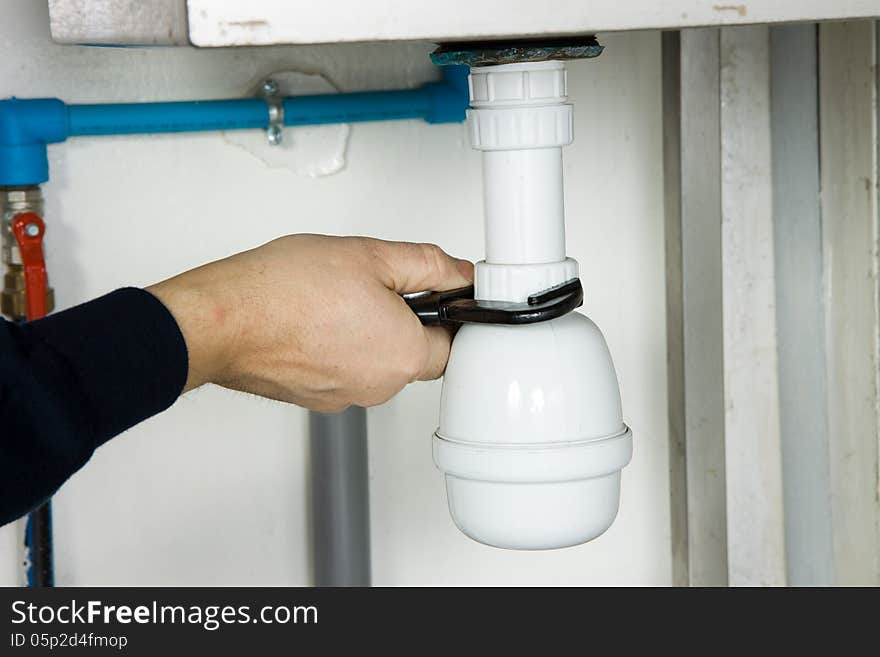 Plumber at work in a industrial site