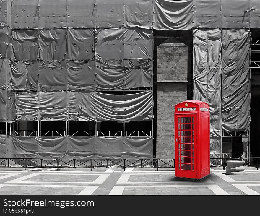 Red telephone booth, construction site scaffold tarpaulin canvas background. Red telephone booth, construction site scaffold tarpaulin canvas background