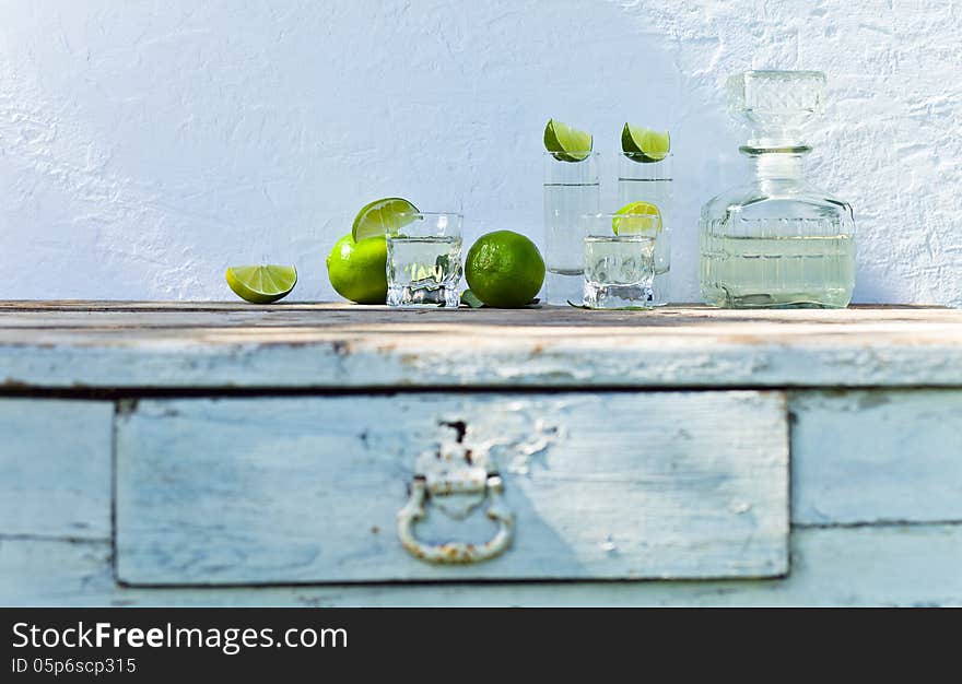 Tequila and lime on a old table