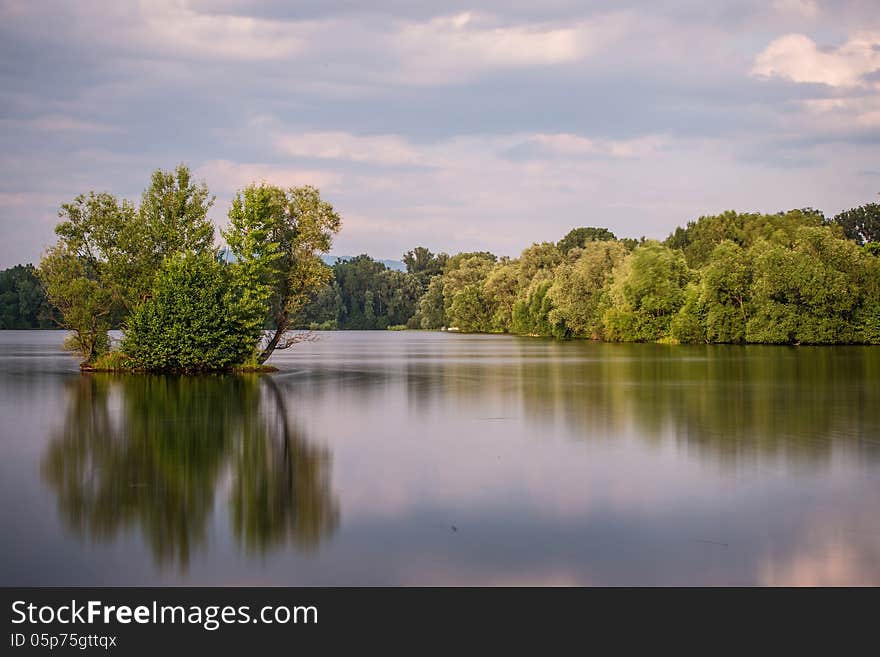 Sunrice behind lakes in the near forest