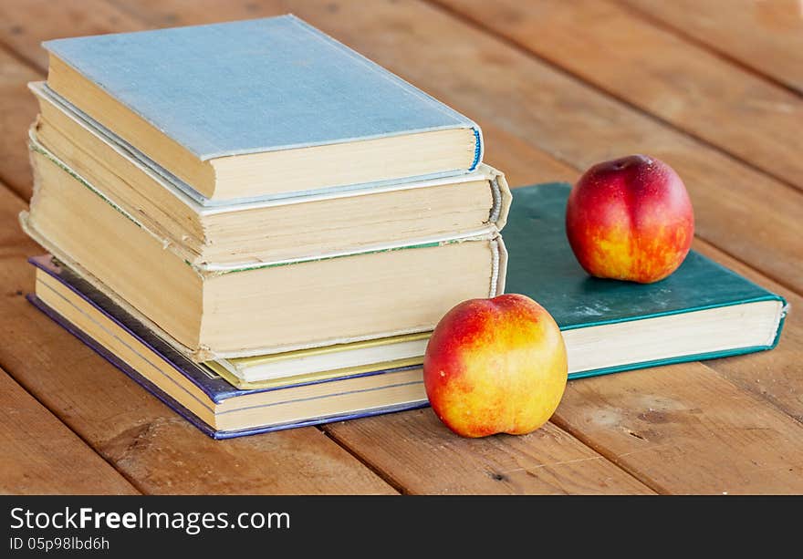 A Stack of old books on wooden background